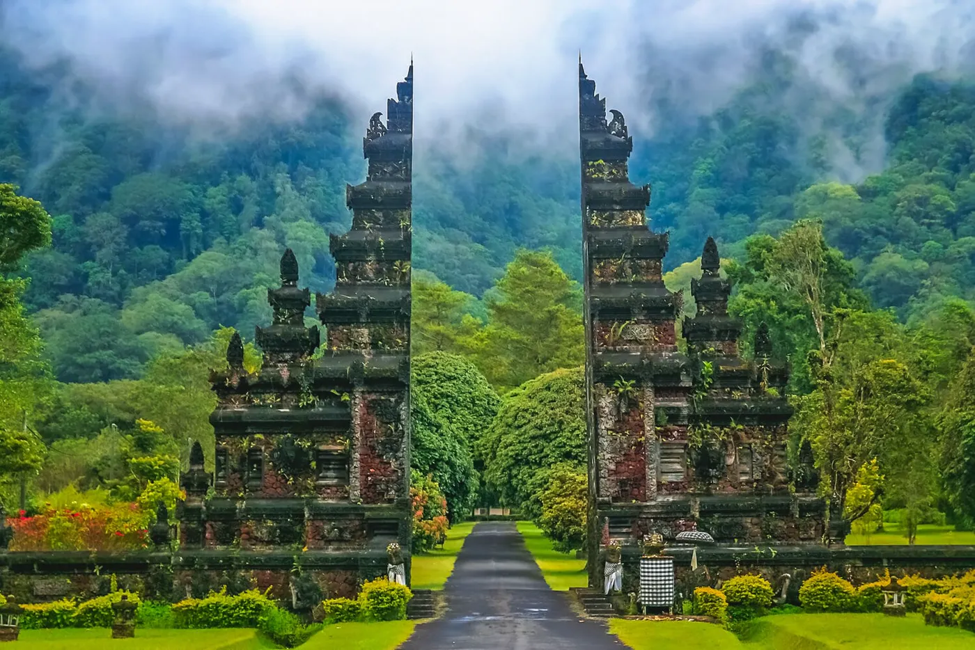 A temple gate in the misty green hills of Bali